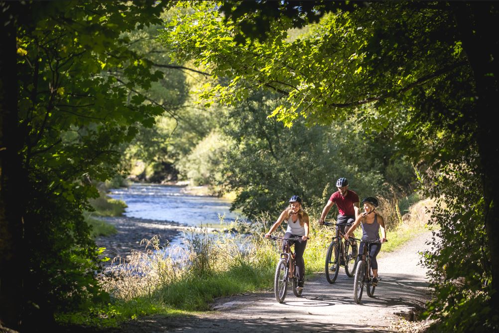 Biking alongside the Arrow River